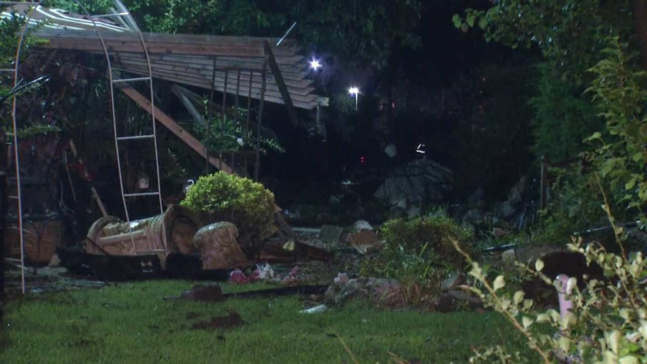 Police: Driver Flees After Pickup Crashes Through Tulsa Home's Yard