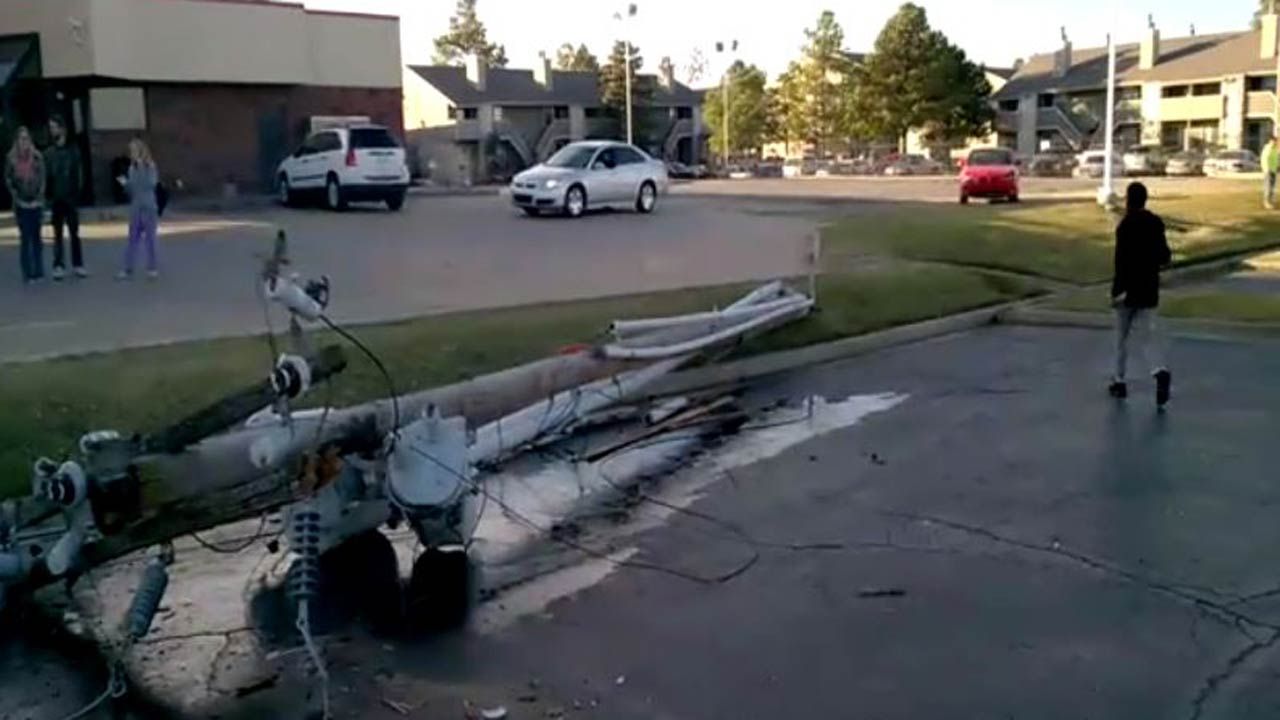 Power Lines Land On Car When Excavator Hits Utility Pole In Tulsa