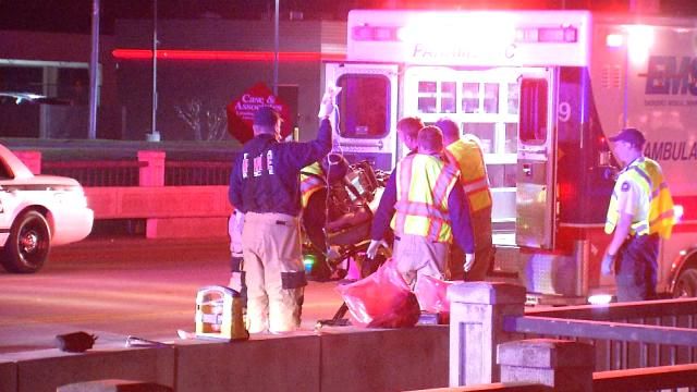 The fatally injured man is loaded on an ambulance early Sunday.