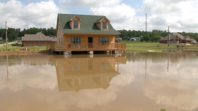 Skiatook Home Nestled Over Full Pond Thanks To Rain