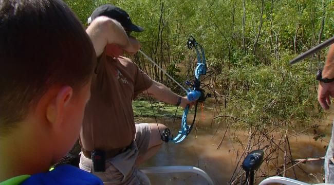 Tess Maune And Dick Faurot Get A Lesson In Bow Fishing