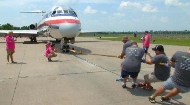 Teams Pull A Plane For Green Country Charity