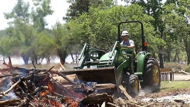 Oklahoma Park Rangers Work To Clear Debris As Water Recedes