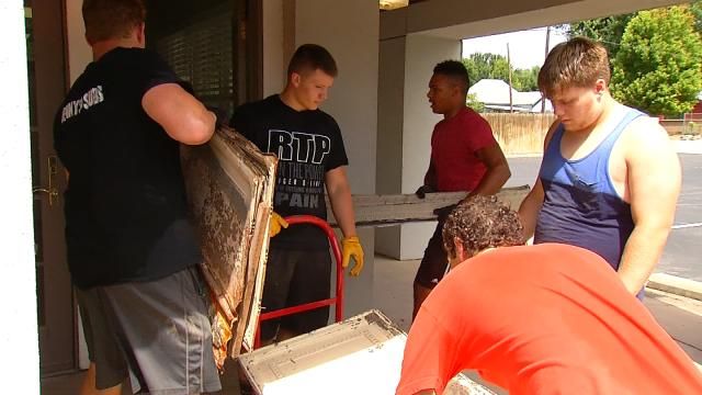 BA Football Team Helps Preserve Historic Ceiling Tiles