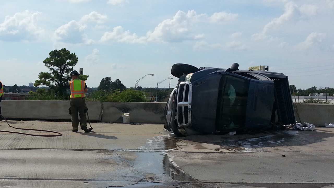 Overturned Truck Damages U.S. 169 Concrete Barrier; Occupants Flee