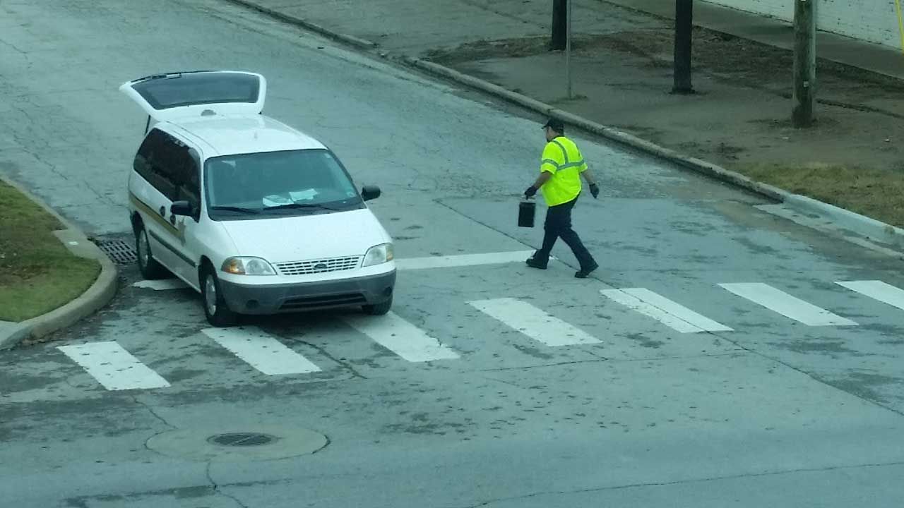 City Worker Collects Meter Money, Drives With Door Open
