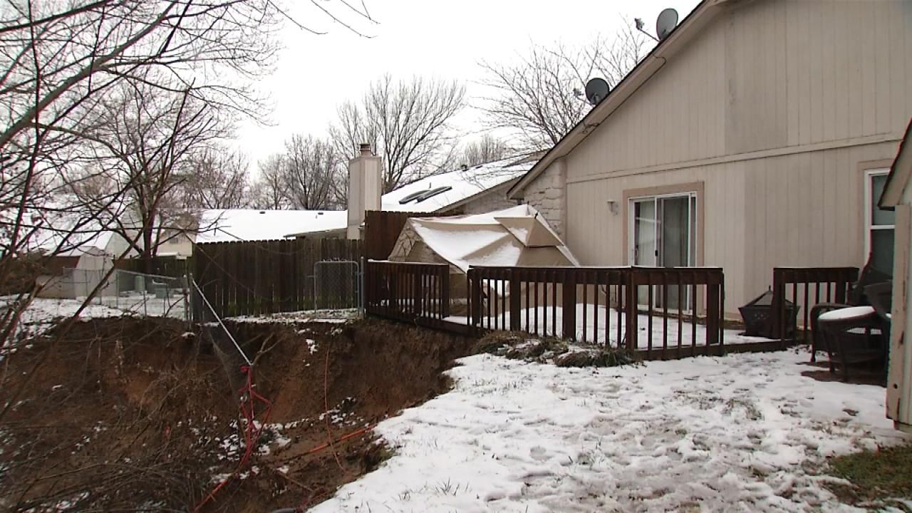 As Rain Falls, BA Family's Yard Washes Away